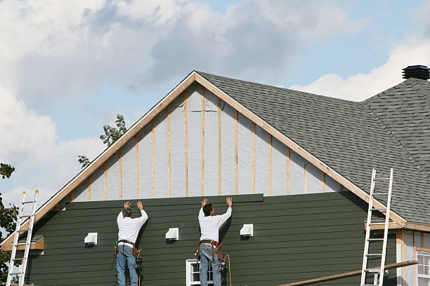 Professional Storm Damage Siding Repair technician working in Waverly, NY